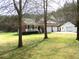 Charming brick home with a manicured front yard, inviting porch, and attached two-car garage at 28 County Line #2 Rd, Rydal, GA 30171