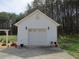 Detached one car garage featuring white siding, clean design, and landscaping, in a large backyard at 28 County Line #2 Rd, Rydal, GA 30171