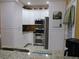 Modern kitchen featuring granite countertops, stainless steel appliances, and ample white cabinetry at 28 County Line #2 Rd, Rydal, GA 30171