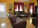 Warm and inviting living room with leather seating, stylish decor, and natural light at 28 County Line #2 Rd, Rydal, GA 30171