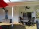 Covered outdoor patio area featuring dining set, ceiling fans and storage at 28 County Line #2 Rd, Rydal, GA 30171