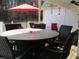Covered patio with outdoor dining set, perfect for entertaining guests at 28 County Line #2 Rd, Rydal, GA 30171