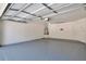 Clean, spacious garage with a neutral gray epoxy floor and white walls at 814 Arbor Hill Dr, Stone Mountain, GA 30088