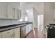 Bright kitchen with granite counters, white cabinets, and stainless steel appliances at 814 Arbor Hill Dr, Stone Mountain, GA 30088