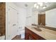 Bathroom featuring a vanity with sink, a toilet, and a shower with brown tile at 221 Semel Nw Cir # 245, Atlanta, GA 30309