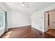 Spacious bedroom with hardwood floors, a ceiling fan, and ample natural light at 221 Semel Nw Cir # 245, Atlanta, GA 30309