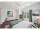 Bright bedroom with a large window, ceiling fan, stylish furnishings, and hardwood floors at 221 Semel Nw Cir # 245, Atlanta, GA 30309