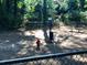 Community dog park area with bench, fire hydrant, and waste station in a fenced space at 221 Semel Nw Cir # 245, Atlanta, GA 30309