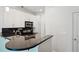 Well-lit kitchen featuring white cabinets, granite countertops, and stainless steel appliances at 221 Semel Nw Cir # 245, Atlanta, GA 30309