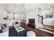 Bright living room featuring hardwood floors, a comfortable sofa, and a modern ceiling fan at 221 Semel Nw Cir # 245, Atlanta, GA 30309