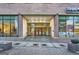 Detailed view of the building entrance, with glass doors and Peachtree Towers signage at 300 Peachtree Ne St # 5A, Atlanta, GA 30308