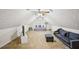 Finished attic space with multiple ceiling fans and comfortable seating at 330 Pitts Chapel Rd, Newborn, GA 30056