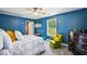 Cozy bedroom featuring a ceiling fan and ample natural light perfect for relaxation at 330 Pitts Chapel Rd, Newborn, GA 30056