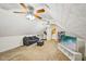 Bright bonus room with carpeted floor and two ceiling fans is perfect for flexible living at 330 Pitts Chapel Rd, Newborn, GA 30056