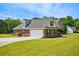 A lovely brick home boasting an attached garage and well-kept landscaping at 330 Pitts Chapel Rd, Newborn, GA 30056