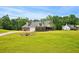 A charming brick home with expansive yard and a well-maintained lawn at 330 Pitts Chapel Rd, Newborn, GA 30056