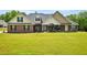 Charming single story brick home with well-manicured lawn and mature landscaping at 330 Pitts Chapel Rd, Newborn, GA 30056