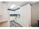 Bright kitchen featuring white cabinets, a microwave and a large refrigerator at 330 Pitts Chapel Rd, Newborn, GA 30056