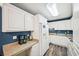 Bright kitchen with white cabinets, stainless steel appliances, and ample counter space at 330 Pitts Chapel Rd, Newborn, GA 30056