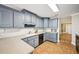 Kitchen with gray cabinets, tile floors and lots of counter space at 330 Pitts Chapel Rd, Newborn, GA 30056