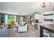 Open-concept living space with bright interiors and a view to the kitchen at 330 Pitts Chapel Rd, Newborn, GA 30056