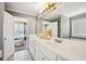 Bathroom features a double vanity, tile flooring and a view to the connected bedroom at 330 Pitts Chapel Rd, Newborn, GA 30056