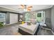 Comfortable main bedroom with lots of natural light and ceiling fan overlooking the backyard at 330 Pitts Chapel Rd, Newborn, GA 30056