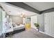 Comfortable main bedroom with neutral tones, ceiling fan, and plush carpeting at 330 Pitts Chapel Rd, Newborn, GA 30056
