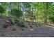 Beautiful backyard with landscaping, mulch, and flowers at 3945 Lorien Way, Kennesaw, GA 30152