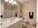 Bathroom featuring a large mirror over a vanity, toilet, and a shower tub with shower curtains at 3945 Lorien Way, Kennesaw, GA 30152