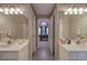 Bathroom with and sink and mirror, and doorway to a bedroom at 3945 Lorien Way, Kennesaw, GA 30152