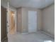 Bedroom with neutral walls and carpet, and two white doors at 3945 Lorien Way, Kennesaw, GA 30152