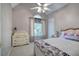 Bedroom featuring natural light, a floral-patterned bedspread, and a white dresser at 3945 Lorien Way, Kennesaw, GA 30152