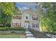 Traditional-style home featuring a manicured lawn and brick-accented landscaping at 3945 Lorien Way, Kennesaw, GA 30152