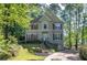 Charming two-story home with red shutters surrounded by mature trees at 3945 Lorien Way, Kennesaw, GA 30152
