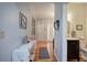 Hallway with table, hardwood floors, leading to the front entrance and half bathroom at 3945 Lorien Way, Kennesaw, GA 30152