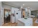 Bright kitchen with island, white cabinets, stainless refrigerator, and hardwood floors at 3945 Lorien Way, Kennesaw, GA 30152