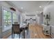 Eat-in kitchen and breakfast nook bathed in natural light next to the kitchen with all-white cabinetry at 3945 Lorien Way, Kennesaw, GA 30152