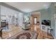 Open-concept living area with hardwood floors connecting the dining, kitchen, and sitting room at 3945 Lorien Way, Kennesaw, GA 30152