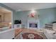 Cozy living room with fireplace, hardwood floors, and view into the sitting area at 3945 Lorien Way, Kennesaw, GA 30152