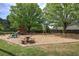 Community playground with play set, swings, and a concrete picnic table on a mulched area at 3945 Lorien Way, Kennesaw, GA 30152