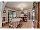 Dining room features floral wallpaper, hardwood floors, and access to a patio area at 4735 Rabbit Farm Rd, Loganville, GA 30052