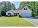 Charming one story home featuring an attached garage and a well maintained lawn and landscape at 4735 Rabbit Farm Rd, Loganville, GA 30052