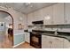 This kitchen is equipped with solid surface counters and stainless appliances at 4735 Rabbit Farm Rd, Loganville, GA 30052