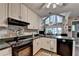 This kitchen is equipped with solid surface counters and stainless appliances at 4735 Rabbit Farm Rd, Loganville, GA 30052