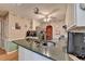 This kitchen is equipped with solid surface counters and stainless appliances at 4735 Rabbit Farm Rd, Loganville, GA 30052