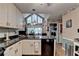 This kitchen is equipped with solid surface counters and stainless appliances at 4735 Rabbit Farm Rd, Loganville, GA 30052
