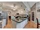 This cozy kitchen has an island, granite countertops, and hardwood floors at 4735 Rabbit Farm Rd, Loganville, GA 30052