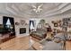 Comfortable living room with a decorative ceiling, hardwood floors, and a cozy fireplace at 4735 Rabbit Farm Rd, Loganville, GA 30052