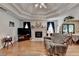 Comfortable living room with a decorative ceiling, hardwood floors, and a cozy fireplace at 4735 Rabbit Farm Rd, Loganville, GA 30052